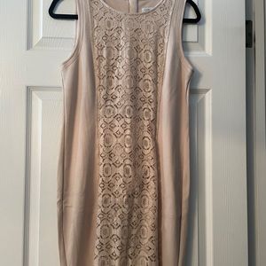 Brand new knee length dress. Lace section down front, zipper back.